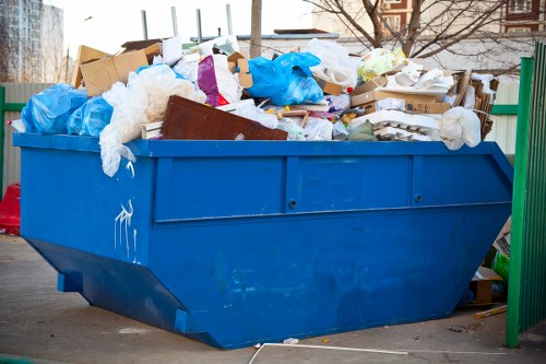 Professional junk removal team clearing furniture