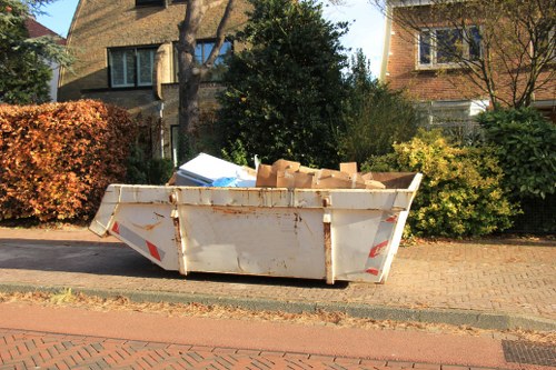 Garden debris being efficiently removed by professionals